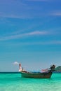 Beautiful seascape with wooden fishing boat. Tropical sea landscape with turquoise water and blue sky. Tropical paradise. Horizon. Royalty Free Stock Photo