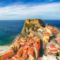 Beautiful seaside town village Scilla with old medieval castle on rock Castello Ruffo Royalty Free Stock Photo