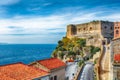 Beautiful seaside town village Scilla with old medieval castle on rock Castello Ruffo Royalty Free Stock Photo