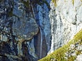 Beautiful seasonal waterfalls under alpine rocks FalknistÃÂ¼rm in the Ratikon border mountain massif or Raetikon Grenzmassiv