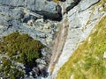 Beautiful seasonal waterfalls under alpine rocks FalknistÃÂ¼rm in the Ratikon border mountain massif or Raetikon Grenzmassiv