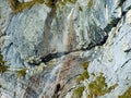 Beautiful seasonal waterfalls under alpine rocks FalknistÃÂ¼rm in the Ratikon border mountain massif or Raetikon Grenzmassiv