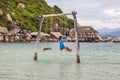 Beautiful, secluded beach in central Vietnamis, 85 km south of Nha Trang. Swing hanging on the beach side