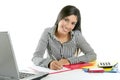 Beautiful secretary businesswoman writing on desk