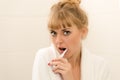 Beautiful seductive blonde woman teeth cleaning