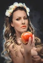 Beautiful seductive woman with apple
