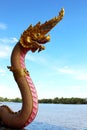 Beautiful Pink and Gold colors of Praya Nark or Naga in Thai temple with colorful sky and sun flare effect on sunrise time Royalty Free Stock Photo