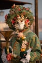 Carnival of Venice 2024 edition - Musician with a lot of flowers and a mask