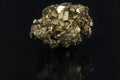 Beautiful semi-precious stone pyrite on a black background Royalty Free Stock Photo