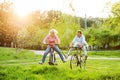 Beautiful senior couple with bicycles outside in spring nature. Royalty Free Stock Photo