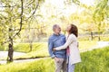 Beautiful senior couple in love outside in spring nature. Royalty Free Stock Photo