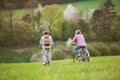 Beautiful senior couple with bicycles cycling outside in spring nature. Royalty Free Stock Photo