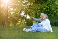 Beautiful senior couple in park. man pointing Royalty Free Stock Photo