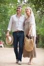 beautiful senior couple poses while walking