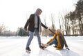 Senior couple in sunny winter nature ice skating. Royalty Free Stock Photo