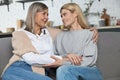 Beautiful senior woman and her adult daughter hugging and smiling Royalty Free Stock Photo