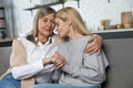 Beautiful senior woman and her adult daughter hugging and smiling Royalty Free Stock Photo