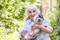 Beautiful senior woman hugging her dog Royalty Free Stock Photo