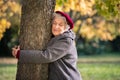 Senior woman hugging tree Royalty Free Stock Photo