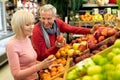 Beautiful senior woman shopping with her husband Royalty Free Stock Photo