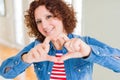 Beautiful senior woman smiling in love showing heart symbol and shape with hands Royalty Free Stock Photo