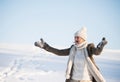 Beautiful senior woman on a walk in sunny winter nature Royalty Free Stock Photo