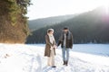 Beautiful senior couple on a walk on sunny winter day