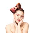 Beautiful sensitive woman with a bow hairstyle and colorful eye shadows