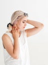 Beautiful sensitive woman touching her neck Royalty Free Stock Photo