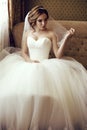 Beautiful sensual bride with dark hair in luxurious lace wedding dress