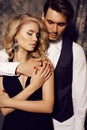 Beautiful sensual couple in elegant clothes posing in studio Royalty Free Stock Photo