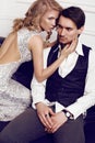 Beautiful sensual couple in elegant clothes posing in studio Royalty Free Stock Photo