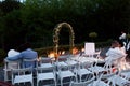 Beautiful sensual romantic couple sitting at wedding aisle in th