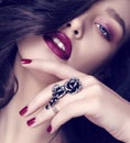 Beautiful sensual woman with dark hair and bright makeup with bijou Royalty Free Stock Photo