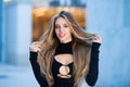 Beautiful sensual woman with long blonde hair. Fashion outdoor photo of beautiful lady wearing elegant dress and posing Royalty Free Stock Photo