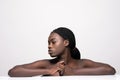 Beautiful sensual african, woman touching her face. Beauty and skincare concept. Spa. Isolated over white Royalty Free Stock Photo