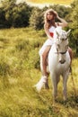 Beautiful sensual women riding on white horse Royalty Free Stock Photo