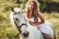 Beautiful sensual women riding on white horse Royalty Free Stock Photo