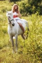 Beautiful sensual women riding on white horse Royalty Free Stock Photo