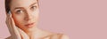 Beautiful sensual young girl with clean skin on a pink background with a mockup. Topless woman. The concept of spa treatments, Royalty Free Stock Photo