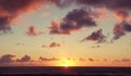 Beautiful serene sunset clouds sky over the ocean horizon