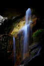 Underground cave waterfall between rock formations