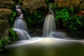 Serene waterfall in a tropical garden Royalty Free Stock Photo