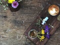 Beautiful serving size of coffee, Heart shape latte art , spoon, tea glass and flower on the wooden tray