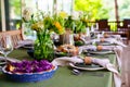 beautiful setting of a large table with flowers. Royalty Free Stock Photo