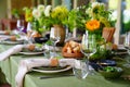 beautiful setting of a large table with flowers. Royalty Free Stock Photo
