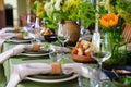 beautiful setting of a large table with flowers. Royalty Free Stock Photo