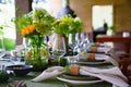 beautiful setting of a large table with flowers. Royalty Free Stock Photo