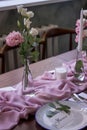 Beautiful setting of wedding party in restaurant. Tables and chairs decorated with flowers and fabrics gently pink in color Royalty Free Stock Photo