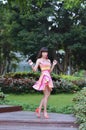 Beautiful and sex Asian girl shows her youth in the park